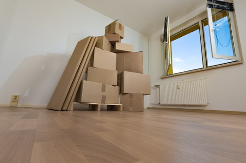 Office relocation equipment and furniture being organised for transport in Haringey