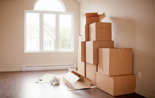 Packed household boxes and furniture prepared for a home move in Haringey