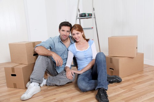 Professional movers handling furniture during house removals in Haringey