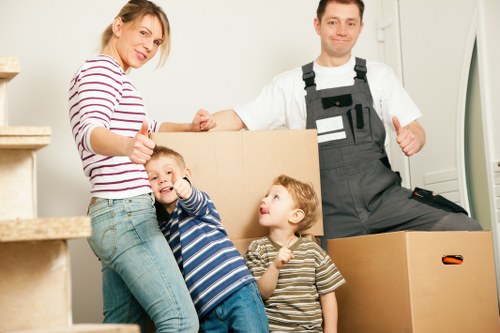 Boxes and furniture being loaded into a moving van