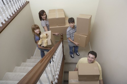Furniture being carried through a flat staircase in Haringey